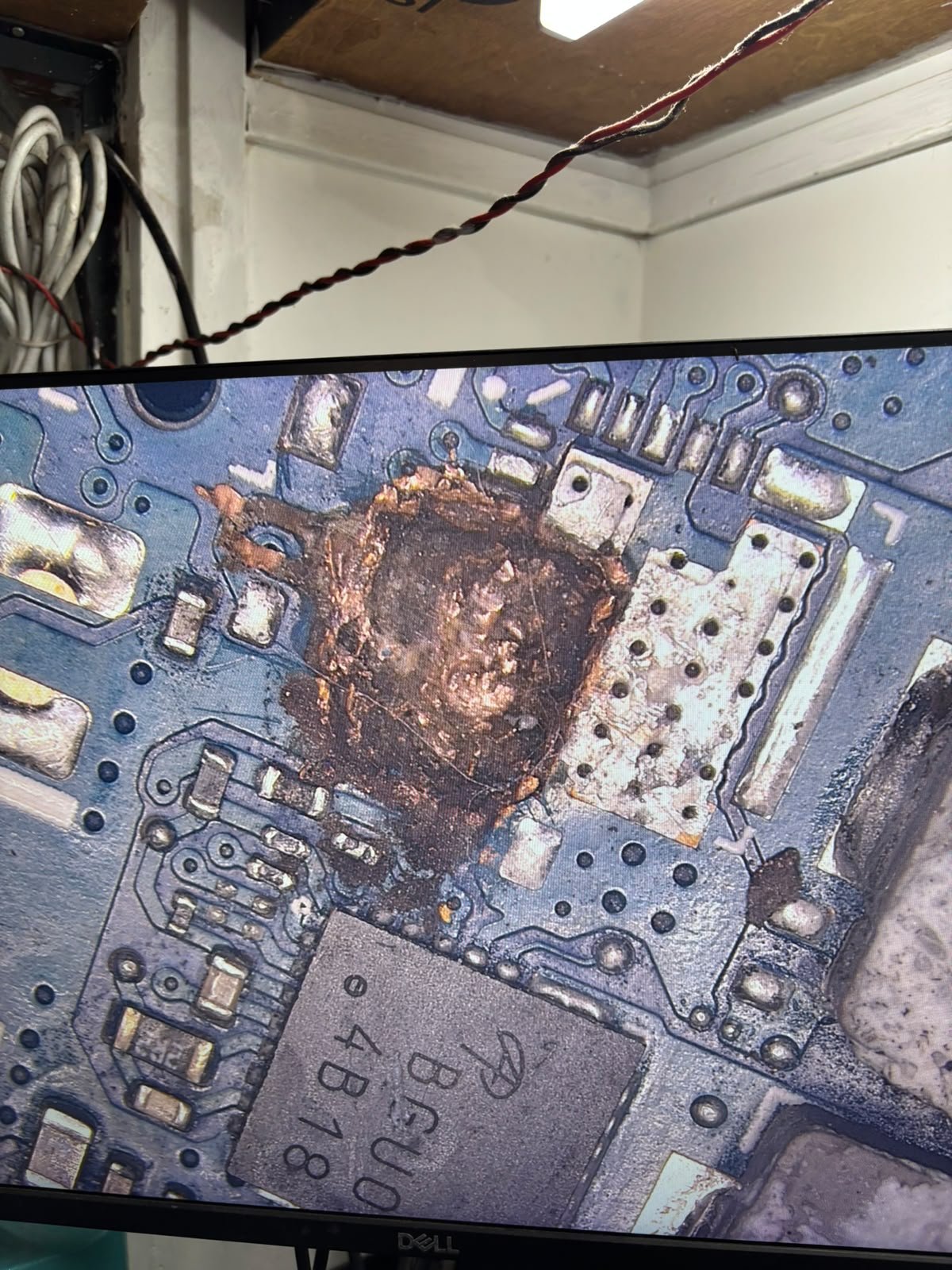 Burnt motherboard under microscope